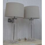 TABLE LAMPS, a pair, in glass with lucite bases and shades, 78cm H.