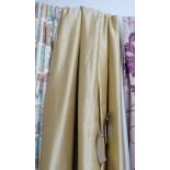 CURTAINS, a pair, in gold silk lined and interlined, gathered 78cm x 275cm drop.