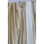 CURTAINS, a pair, in gold silk lined and interlined, gathered 90cm x 277cm drop.