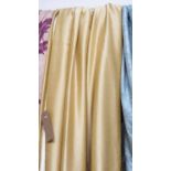 CURTAINS, a pair, in gold silk lined and interlined, gathered 78cm x 275cm drop.