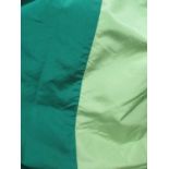 CURTAINS, a pair in bottle green and light green silk, lined and interlined,