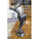 BRONZE, early 20th century, of a dancer holding a mask, on a circular plinth base, 50cm H.