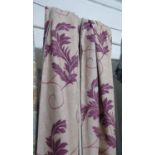 CURTAINS, a pair, in a purple flower design on a cream ground lined, gathered 115cm x 230cm drop.