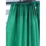CURTAINS, a pair in bottle green silk, lined and interlined, gathered 76cm W x 218cm drop.
