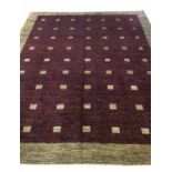 HAND KNOTTED ART DECO STYLE CARPET, 305cm x 25cm, of multiple square on ruby field.