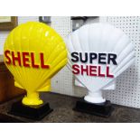 TABLE ORNAMENTS, two, of Shell and Super Shell signs on ebonised bases, 59cm H.