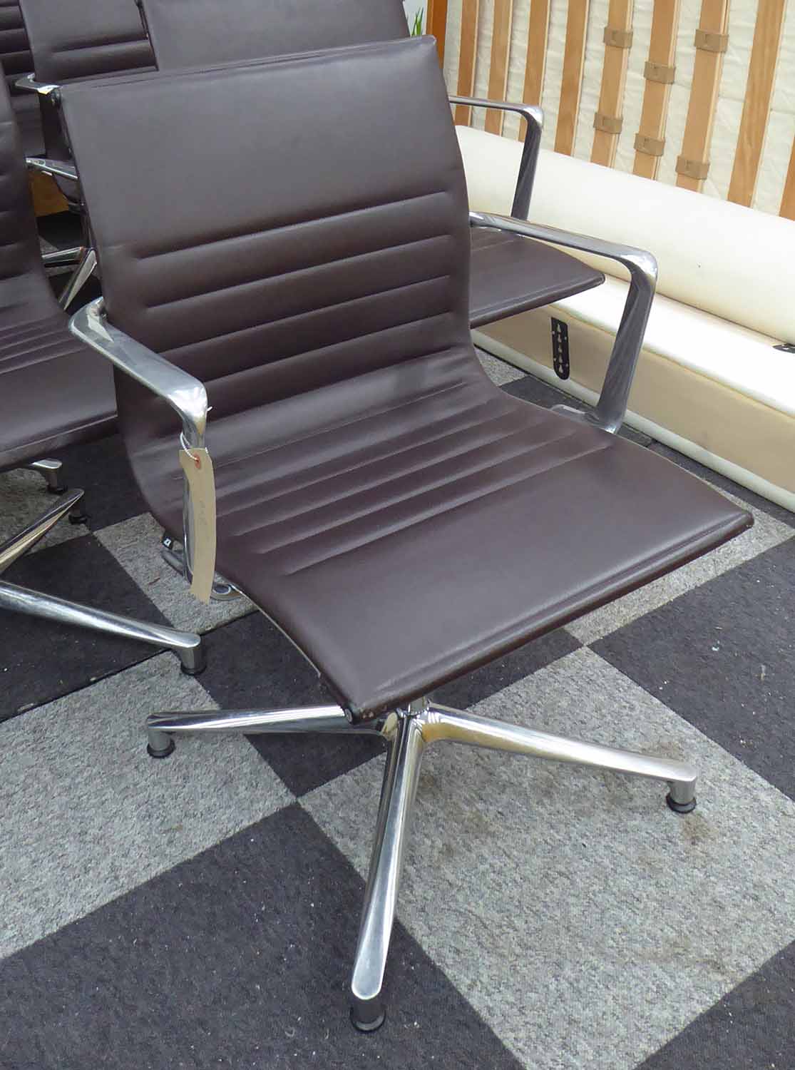 ICF EAMES STYLE OFFICE CHAIR, in tanned leather on chromed metal frames, 61cm W.