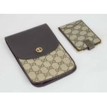 GUCCI MONOGRAM PHONE/CIGARETTE HOLDER, dark leather trims and flap snap closure with iconic GG logo,