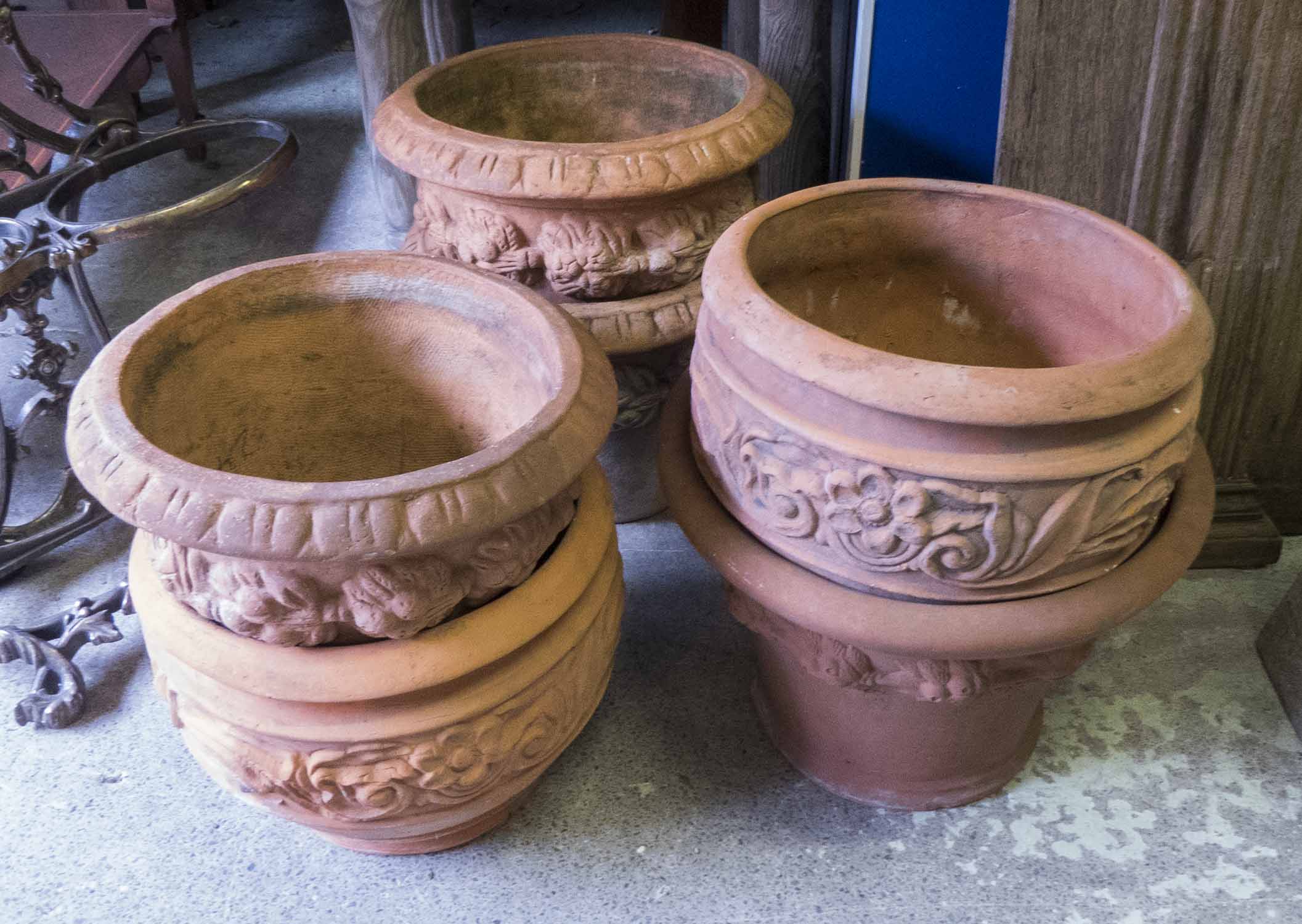 TERRACOTTA PLANT POTS, a selection of six, 20th century, various designs, tallest 33cm H.