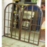 GARDEN MIRRORS, a pair, metal framed, each with an arched top, 90cm W x 171cm H.