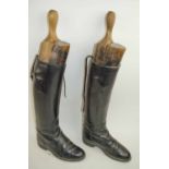 A PAIR OF ANTIQUE WOOD BOOT JACKS.