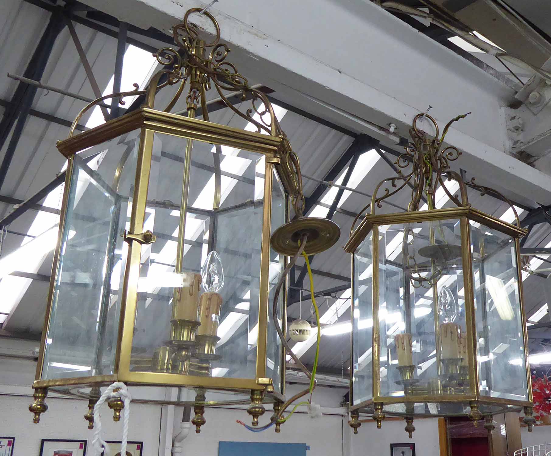 HALL LANTERNS, a pair, hexagonal brass frames with glazed panels, each 71cm H x 33cm W.