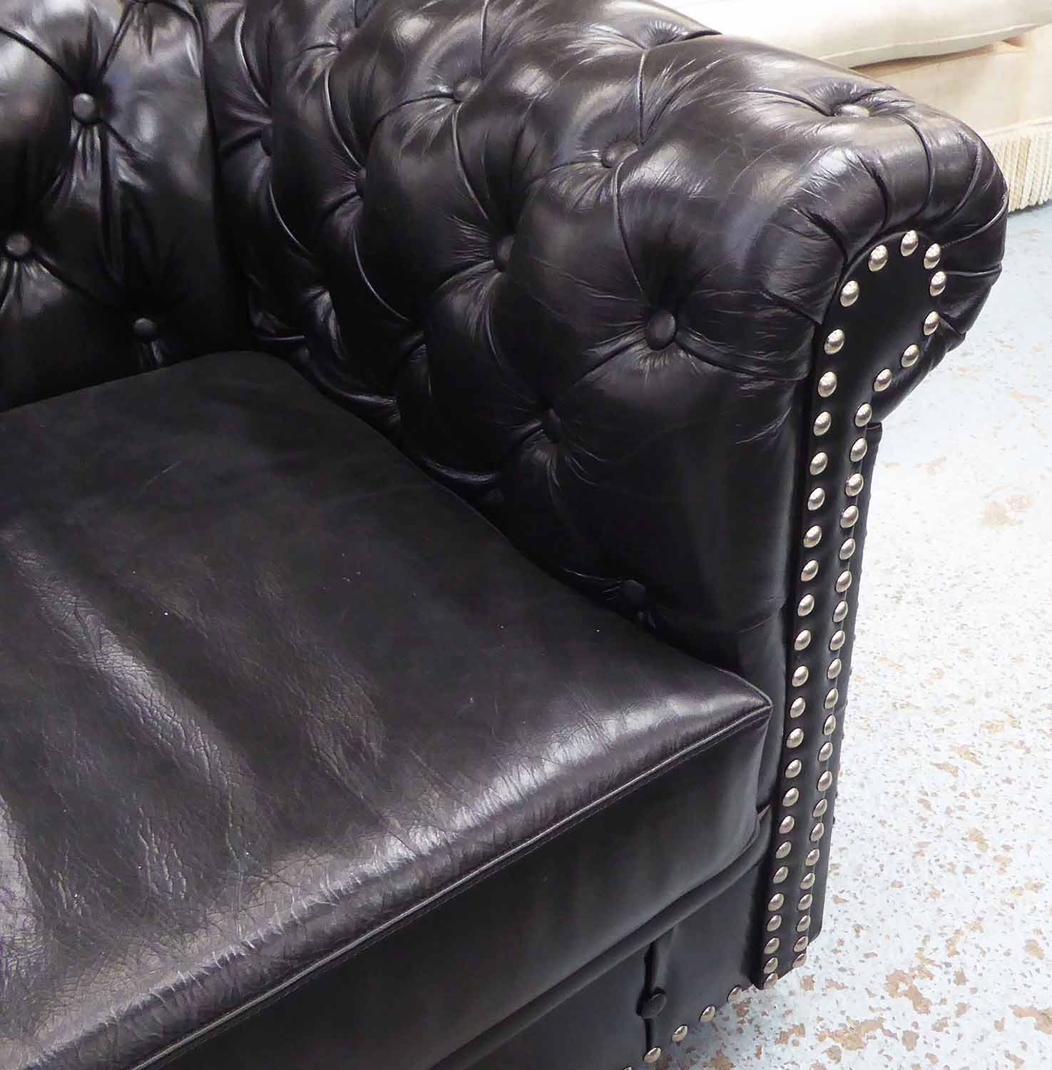 CHESTERFIELD STYLE SOFA, of large proportions, in black buttoned back leather with chrome studs, - Image 2 of 2