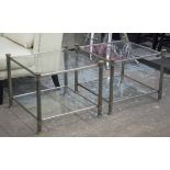 LOW TABLES, a pair, silvered metal and brass with two square glass tiers, 51cm H x 64cm W.