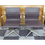 ICF EAMES STYLE OFFICE CHAIRS, a pair, in tanned leather on chromed metal frames, 61cm W.