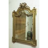 WALL MIRROR, late 19th century French giltwood and gesso with a wreath,