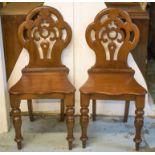 HALL CHAIRS, a pair, Victorian mahogany, each with shaped and pierced back.