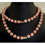 A FINE CORAL BEAD AND FLUTED YELLOW METAL OPERA LENGTH NECKLACE, 110 grams approx 92cm L.