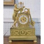 A FRENCH EMPIRE CLOCK, circa 1825, designed at a young man playing a lyre, 36cm H x 25cm W.