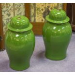 VASES, a pair, Chinese ceramic leaf green jar form, with lids, 59cm H.