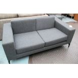 SOFA, two seater, by Hitch Mylius in grey woolen fabric on metal supports, 164cm L.