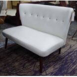 DESIGNERS GUILD SOFA, two seater, in cream leather button back on turned supports, 123cm L.