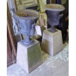 GARDEN URNS, a pair, lead, of classical form on reconstituted stone bases, overall each 79cm H.