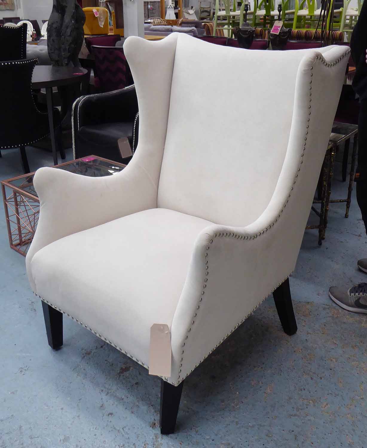 WING BACK ARMCHAIR, contemporary on ebonised swept legs, 113cm H.