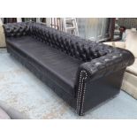 CHESTERFIELD STYLE SOFA, of large proportions, in black buttoned back leather with chrome studs,