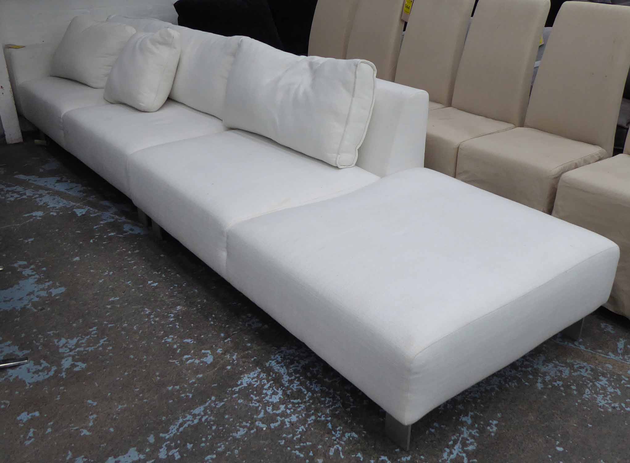 SOFA, by Designers Guild, Model 'Lino', cream on metal supports, in two sections,