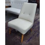 DESIGNER GUILD CHAIR, in cream leather button back on turned supports, 59cm W.