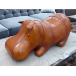 FOOTSTOOL, in tanned leather of a hippopotamus laying down, 72cm L.