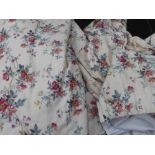 CURTAINS, a pair, floral design on a cream background, lined and interlined,