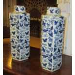 CHINESE STYLE JARS WITH COVERS, a pair, blue and white with butterfly decoration, 52cm H.