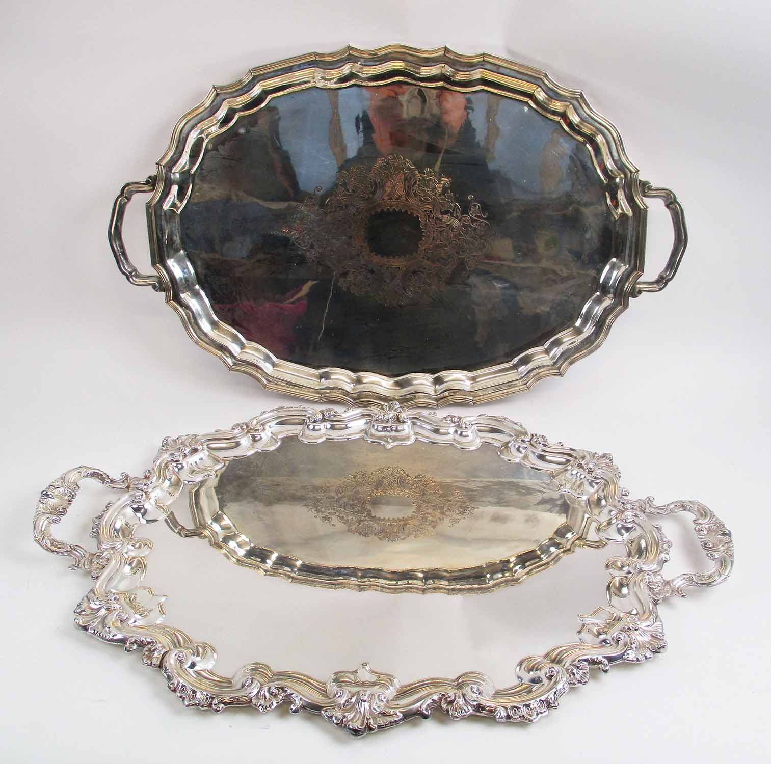 TWO LARGE SILVER PLATED SERVING TRAYS, each approximately 72cm x 50cm.