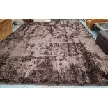 TUFTED RUG, of large proportions, in brown, 400cm x 530cm.