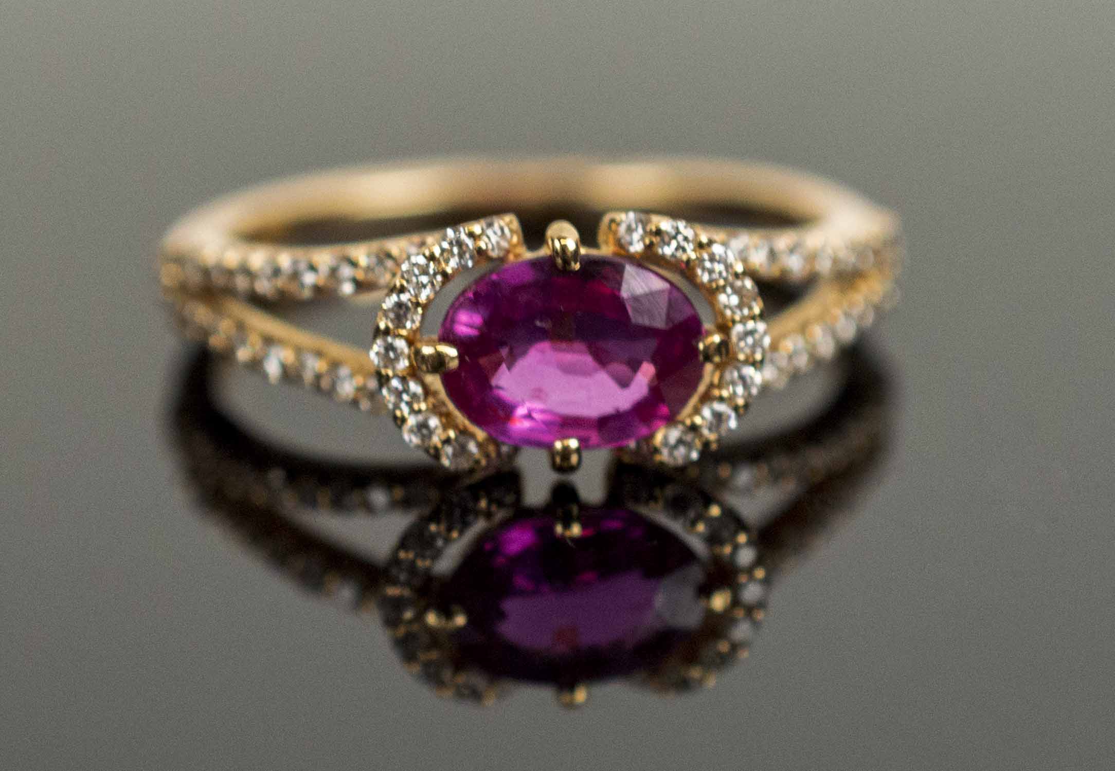 A PINK SAPPHIRE 18k YELLOW GOLD AND MICRO SET DIAMOND DRESS RING, approx. weight of pink sapphire 0.