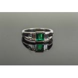 THREE STONE RING, the emerald weighing 0.96 carats, of excellent colour.