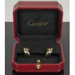 CARTIER, a pair of three coloured 18 carat gold earclips in Cartier case,