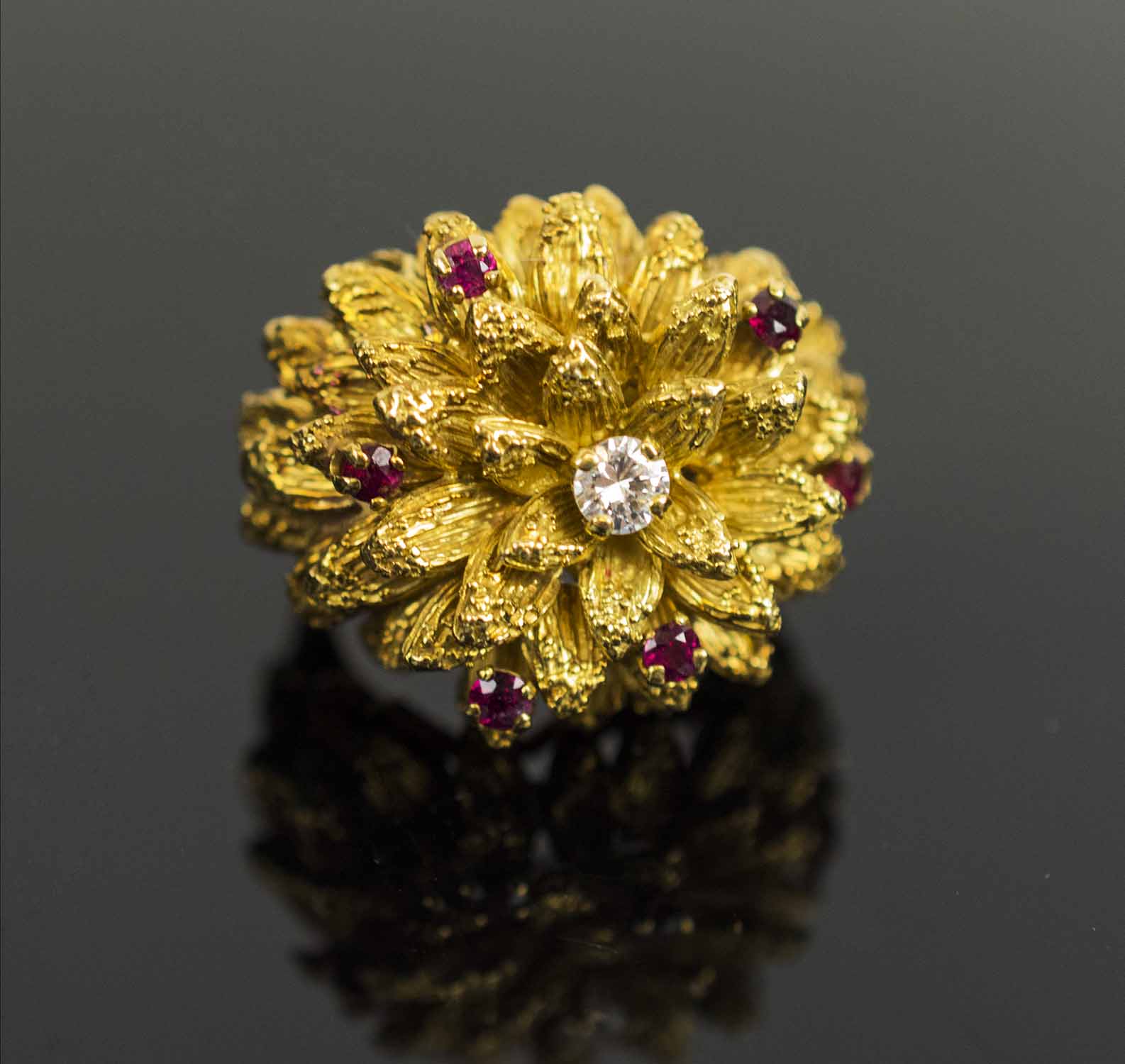 A 1950's RUBY AND DIAMOND SET DRESS RING, of flower design, finger size J, total weight 21.6 grams. - Image 2 of 2