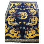 CHINESE PEKING DRAGON CARPET, of polychrome dragons on sapphire field.