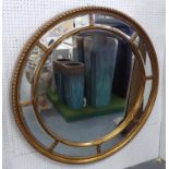 CIRCULAR WALL MIRROR, gilt with divided bevelled plates, 112cm W.
