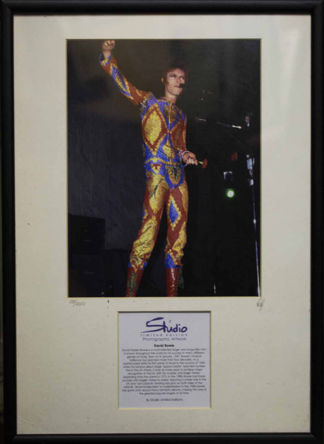 PHOTOPRINT OF DAVID BOWIE, signed and numbered 128/2500, 42cm x 32cm overall, framed and glazed.