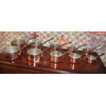 GRADUATED COPPER PANS, a set of five, the largest 18cm diam and another set of five.