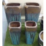 PLANTERS, two pairs, fired clay, large 63cm W x 51cm H, medium 50cm W x 40cm H.