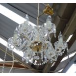 GLASS CHANDELIER, six branch with swept arms on a brass frame, 30cm H, plus chain.
