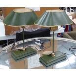 LAMPS, a pair, green stems with green and gilt toleware shades, 43cm H.