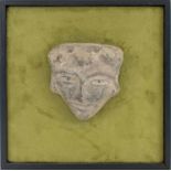 ANTIQUE MEXICAN TERRACOTTA DEITY MASK, later mounted on green suede, framed.