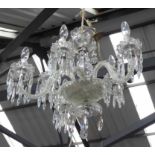 CHANDELIER, six branch with twisted swept arms in glass on a metal frame, 45cm H, plus chain.