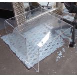 PERSPEX LOW TABLES, two, of curved form, the largest 40cm D x 60cm W x 42cm H.
